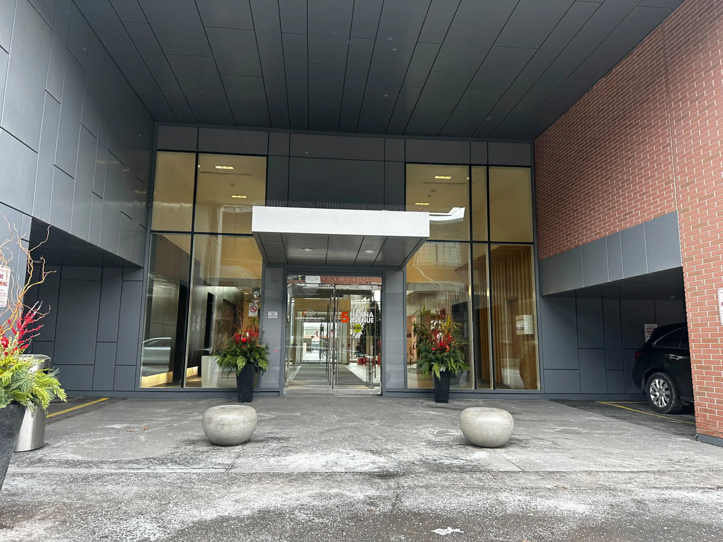 Public parking pedestrian entrance sign at 5 Hanna Ave Toronto Liberty Village for World Cup 2026 BMO Field parking 10 minutes walk from the stadium