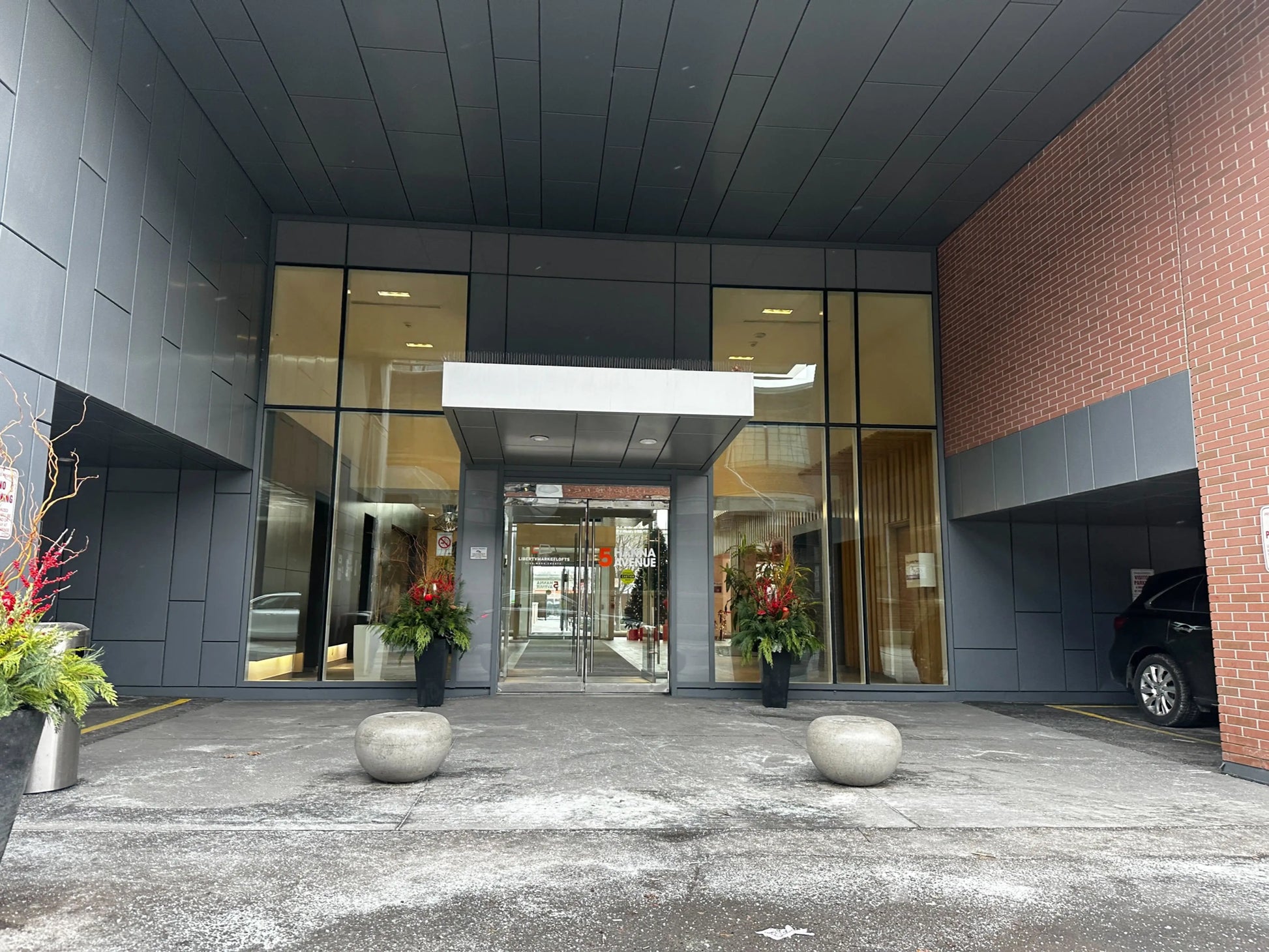 Public parking pedestrian entrance sign at 5 Hanna Ave Toronto Liberty Village for World Cup 2026 BMO Field parking 10 minutes walk from the stadium